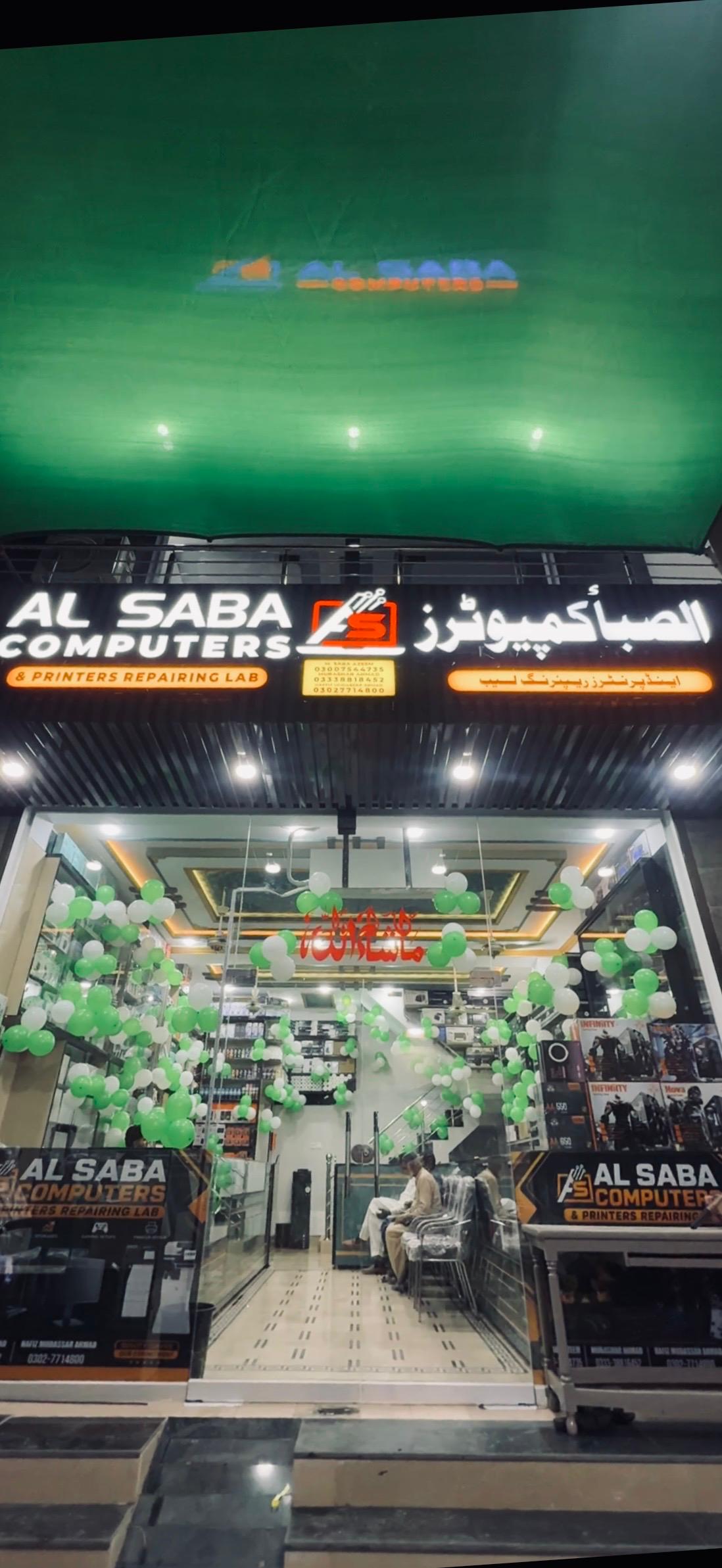 The renovated Al Saba Computer shopfront in Haroonabad at night